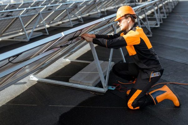 electrician-connecting-solar-panels-2021-09-02-01-01-24-utc-piyyh375hjeu9yojpfmt8iprmg9gcsnfn8l47wtig8
